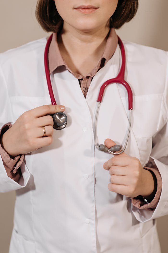 Portrait of a female doctor holding a stethoscope, symbolizing healthcare and professionalism.
